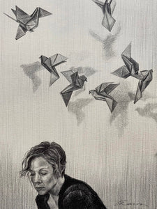 Graphite drawing of woman with short hair, thinking and surrounded by paper cranes. 7"x10" (12.25"x15.25" framed) graphite on paper by April Dawes